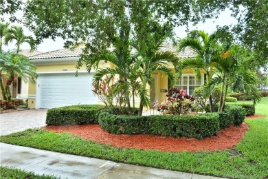 This Bermuda with it's inviting front porch and open-kitchen on The Florida Club in Florida - for sale on GolfHomes.com, golf home, golf lot