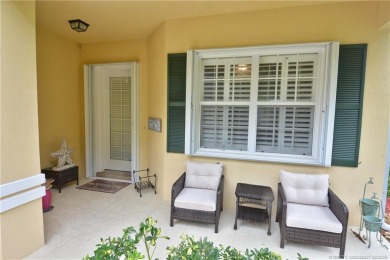 This Bermuda with it's inviting front porch and open-kitchen on The Florida Club in Florida - for sale on GolfHomes.com, golf home, golf lot