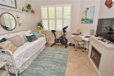 This Bermuda with it's inviting front porch and open-kitchen on The Florida Club in Florida - for sale on GolfHomes.com, golf home, golf lot