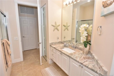 This Bermuda with it's inviting front porch and open-kitchen on The Florida Club in Florida - for sale on GolfHomes.com, golf home, golf lot