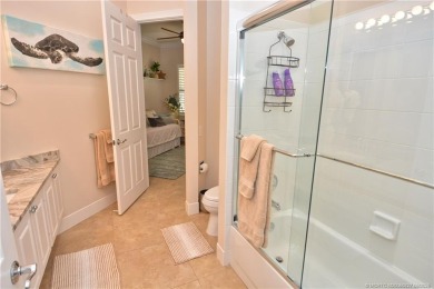 This Bermuda with it's inviting front porch and open-kitchen on The Florida Club in Florida - for sale on GolfHomes.com, golf home, golf lot