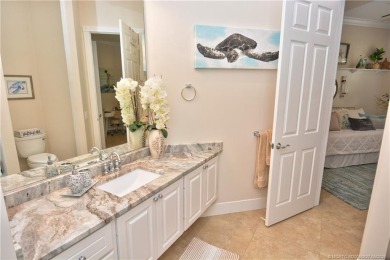 This Bermuda with it's inviting front porch and open-kitchen on The Florida Club in Florida - for sale on GolfHomes.com, golf home, golf lot