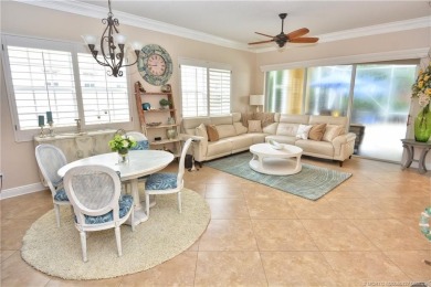 This Bermuda with it's inviting front porch and open-kitchen on The Florida Club in Florida - for sale on GolfHomes.com, golf home, golf lot