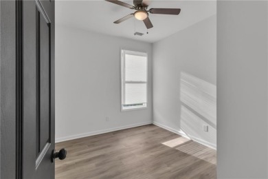 Discover this completely renovated 5-bedroom, 2.5-bathroom home on Wolf Creek Golf Course in Georgia - for sale on GolfHomes.com, golf home, golf lot