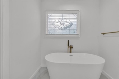 Discover this completely renovated 5-bedroom, 2.5-bathroom home on Wolf Creek Golf Course in Georgia - for sale on GolfHomes.com, golf home, golf lot