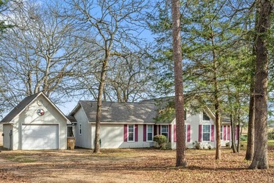 Tucked away on a beautifully wooded lot in the heart of East on Holly Lake Ranch Golf Club in Texas - for sale on GolfHomes.com, golf home, golf lot