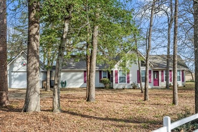 Tucked away on a beautifully wooded lot in the heart of East on Holly Lake Ranch Golf Club in Texas - for sale on GolfHomes.com, golf home, golf lot