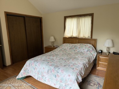 Spacious 3 bedroom home with fireplace and unfinished basement on Pocono Farms Country Club in Pennsylvania - for sale on GolfHomes.com, golf home, golf lot
