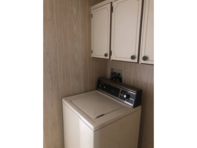 Located in the desirable gated, 55+ community this charming on Golden Lakes Golf Course in Florida - for sale on GolfHomes.com, golf home, golf lot