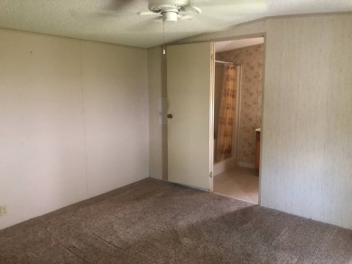 Located in the desirable gated, 55+ community this charming on Golden Lakes Golf Course in Florida - for sale on GolfHomes.com, golf home, golf lot
