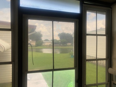 Located in the desirable gated, 55+ community this charming on Golden Lakes Golf Course in Florida - for sale on GolfHomes.com, golf home, golf lot