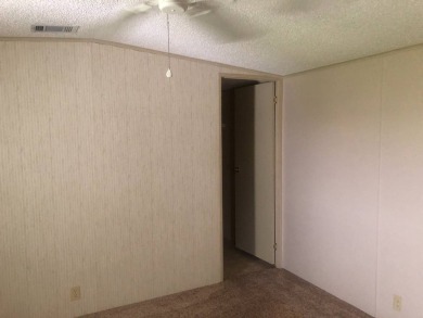Located in the desirable gated, 55+ community this charming on Golden Lakes Golf Course in Florida - for sale on GolfHomes.com, golf home, golf lot