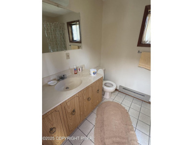 Spacious 3 bedroom home with fireplace and unfinished basement on Pocono Farms Country Club in Pennsylvania - for sale on GolfHomes.com, golf home, golf lot