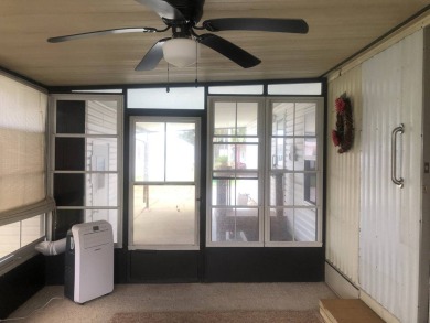 Located in the desirable gated, 55+ community this charming on Golden Lakes Golf Course in Florida - for sale on GolfHomes.com, golf home, golf lot