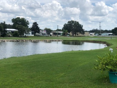 Located in the desirable gated, 55+ community this charming on Golden Lakes Golf Course in Florida - for sale on GolfHomes.com, golf home, golf lot