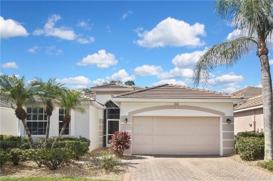 Nestled within the serene and gated Estero Country Club - The on Estero Country Club in Florida - for sale on GolfHomes.com, golf home, golf lot