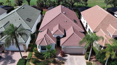 Nestled within the serene and gated Estero Country Club - The on Estero Country Club in Florida - for sale on GolfHomes.com, golf home, golf lot