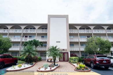 Step into the epitome of serene living with this delightful on Wynmoor Golf Course in Florida - for sale on GolfHomes.com, golf home, golf lot