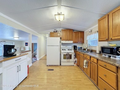 SNOWBIRDS OR HOMEOWNERS WELCOME- YOU OWN the land. 2 Bedroom on Glen Lakes Country Club in Florida - for sale on GolfHomes.com, golf home, golf lot