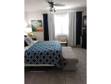 Nicely upgraded, top floor, fully tiled condo with screened on Sunrise Lakes Phase IV Golf Course in Florida - for sale on GolfHomes.com, golf home, golf lot