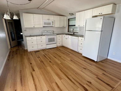 This updated 1985 single-wide mobile home offers just over 800 on Heather Hills Golf Course in Florida - for sale on GolfHomes.com, golf home, golf lot