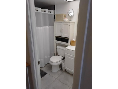 Nicely upgraded, top floor, fully tiled condo with screened on Sunrise Lakes Phase IV Golf Course in Florida - for sale on GolfHomes.com, golf home, golf lot