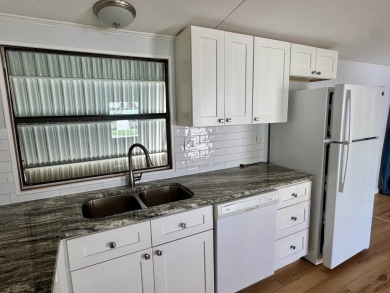 This updated 1985 single-wide mobile home offers just over 800 on Heather Hills Golf Course in Florida - for sale on GolfHomes.com, golf home, golf lot