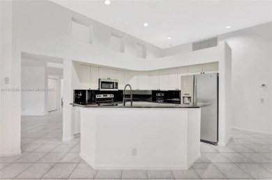 NICE... 3 BEDROOMS 3 FULL BATHROOMS ONE STORY WATERFRONT HOME on Weston Hills Country Club in Florida - for sale on GolfHomes.com, golf home, golf lot