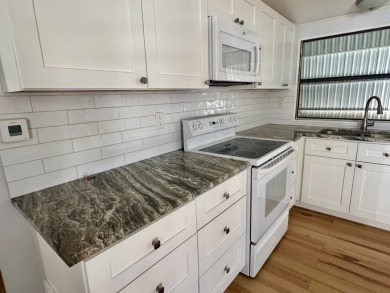 This updated 1985 single-wide mobile home offers just over 800 on Heather Hills Golf Course in Florida - for sale on GolfHomes.com, golf home, golf lot