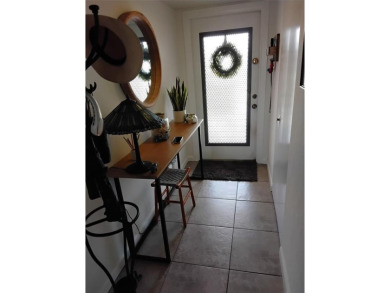 Nicely upgraded, top floor, fully tiled condo with screened on Sunrise Lakes Phase IV Golf Course in Florida - for sale on GolfHomes.com, golf home, golf lot