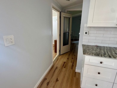 This updated 1985 single-wide mobile home offers just over 800 on Heather Hills Golf Course in Florida - for sale on GolfHomes.com, golf home, golf lot