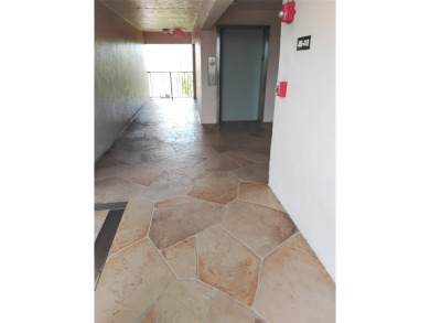 Nicely upgraded, top floor, fully tiled condo with screened on Sunrise Lakes Phase IV Golf Course in Florida - for sale on GolfHomes.com, golf home, golf lot