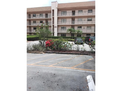 Nicely upgraded, top floor, fully tiled condo with screened on Sunrise Lakes Phase IV Golf Course in Florida - for sale on GolfHomes.com, golf home, golf lot