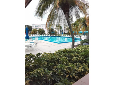 Nicely upgraded, top floor, fully tiled condo with screened on Sunrise Lakes Phase IV Golf Course in Florida - for sale on GolfHomes.com, golf home, golf lot