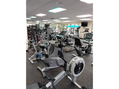Nicely upgraded, top floor, fully tiled condo with screened on Sunrise Lakes Phase IV Golf Course in Florida - for sale on GolfHomes.com, golf home, golf lot
