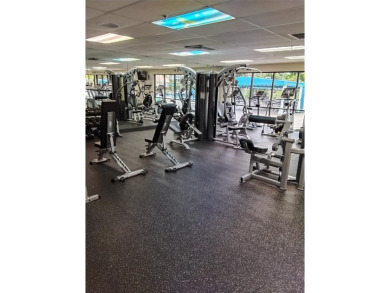 Nicely upgraded, top floor, fully tiled condo with screened on Sunrise Lakes Phase IV Golf Course in Florida - for sale on GolfHomes.com, golf home, golf lot