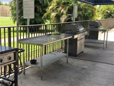 Nicely upgraded, top floor, fully tiled condo with screened on Sunrise Lakes Phase IV Golf Course in Florida - for sale on GolfHomes.com, golf home, golf lot