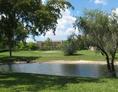 Nicely upgraded, top floor, fully tiled condo with screened on Sunrise Lakes Phase IV Golf Course in Florida - for sale on GolfHomes.com, golf home, golf lot