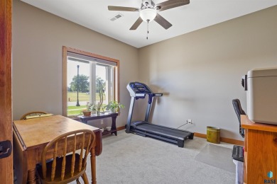 This custom-built 3-bedroom, 2-bath home backs to the 5th hole on The Bridges At Beresford in South Dakota - for sale on GolfHomes.com, golf home, golf lot