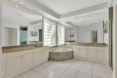NICE... 3 BEDROOMS 3 FULL BATHROOMS ONE STORY WATERFRONT HOME on Weston Hills Country Club in Florida - for sale on GolfHomes.com, golf home, golf lot
