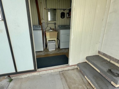 This updated 1985 single-wide mobile home offers just over 800 on Heather Hills Golf Course in Florida - for sale on GolfHomes.com, golf home, golf lot