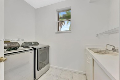 NICE... 3 BEDROOMS 3 FULL BATHROOMS ONE STORY WATERFRONT HOME on Weston Hills Country Club in Florida - for sale on GolfHomes.com, golf home, golf lot