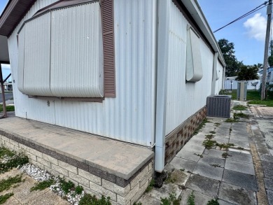 This updated 1985 single-wide mobile home offers just over 800 on Heather Hills Golf Course in Florida - for sale on GolfHomes.com, golf home, golf lot