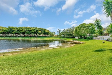 NICE... 3 BEDROOMS 3 FULL BATHROOMS ONE STORY WATERFRONT HOME on Weston Hills Country Club in Florida - for sale on GolfHomes.com, golf home, golf lot