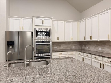 A beautifully designed 3-bedroom, 2-bathroom home by Meritage on The Tribute At the Colony in Texas - for sale on GolfHomes.com, golf home, golf lot