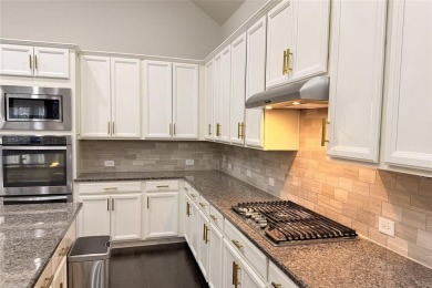 A beautifully designed 3-bedroom, 2-bathroom home by Meritage on The Tribute At the Colony in Texas - for sale on GolfHomes.com, golf home, golf lot