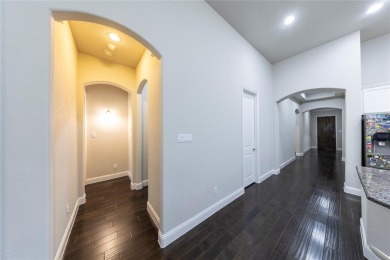 A beautifully designed 3-bedroom, 2-bathroom home by Meritage on The Tribute At the Colony in Texas - for sale on GolfHomes.com, golf home, golf lot