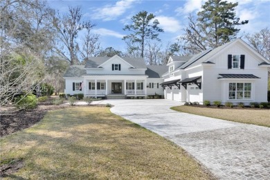 Lowcountry perfection nestled on this large homesite in on Oldfield Golf Club in South Carolina - for sale on GolfHomes.com, golf home, golf lot