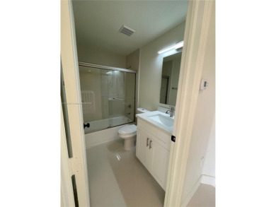 Beautifully remodeled 3BR/2.5BA two-story townhome in the highly on Country Club of Miami in Florida - for sale on GolfHomes.com, golf home, golf lot