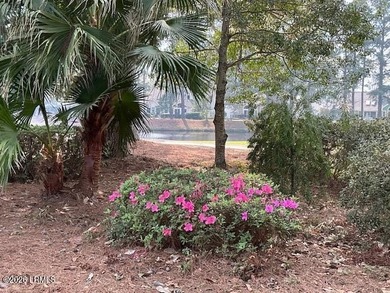 Beautiful golf course and pond views combined with a park-like on Dataw Island Club in South Carolina - for sale on GolfHomes.com, golf home, golf lot